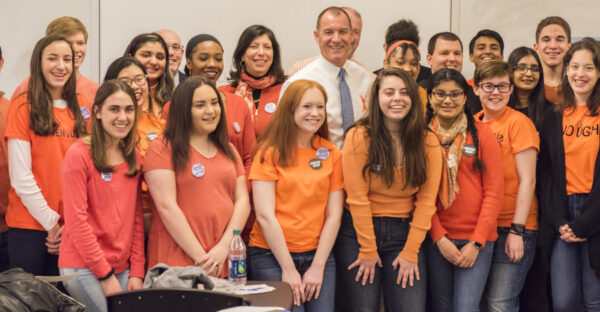 Tom Suozzi surrounded by activist students