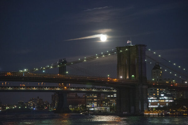 East River, Brooklyn Bridge and Full Moon.