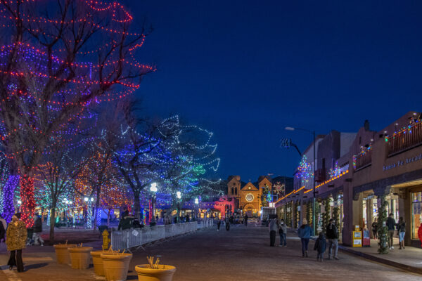 Colorful Santa Fe Plaza and in the background the Cathedral.